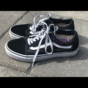 Black and white Vans in mint condition
